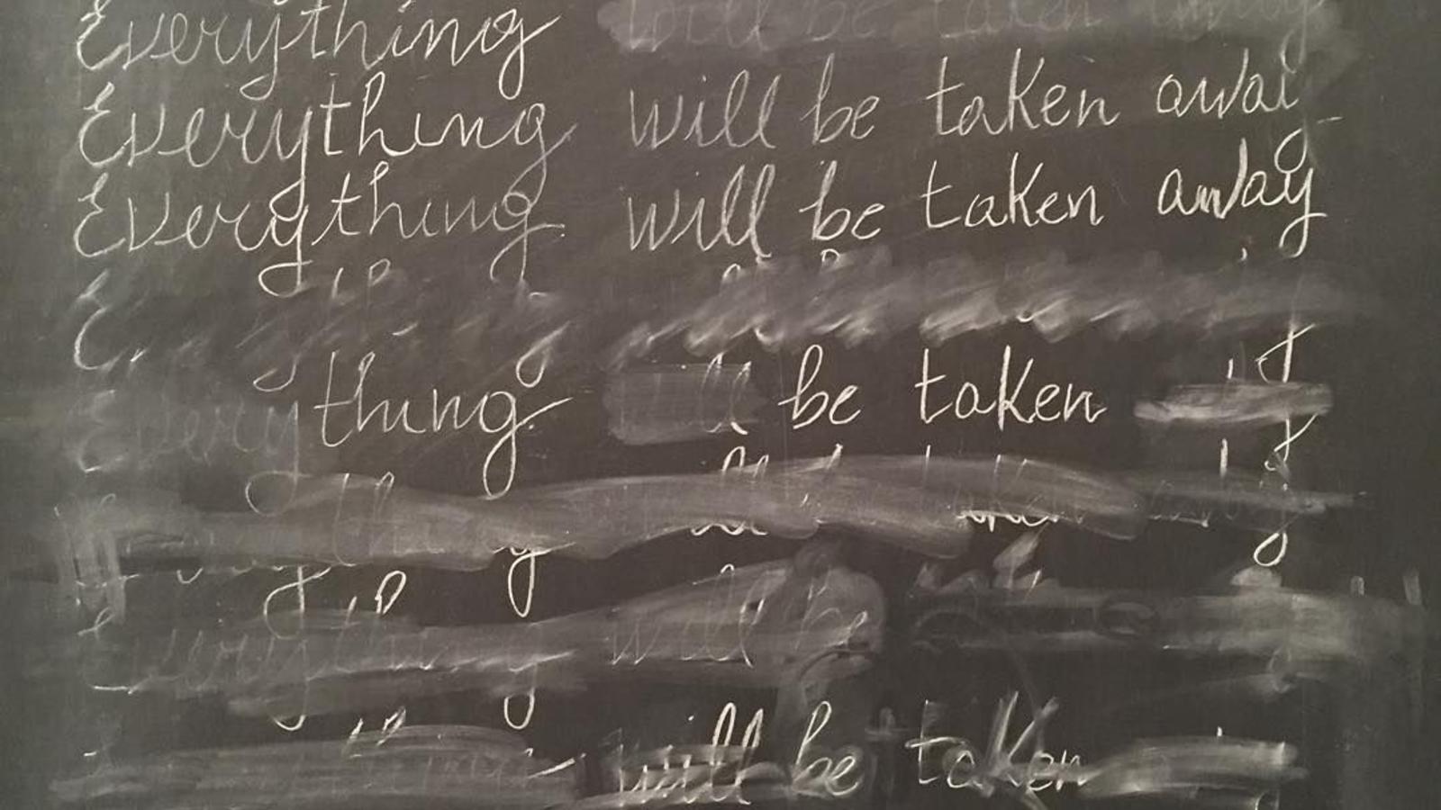 A detail from Adrian Piper's "Everything #21." It features the phrase "Everything will be taken away" written 25 times in cursive (and partially erased) on a blackboard.